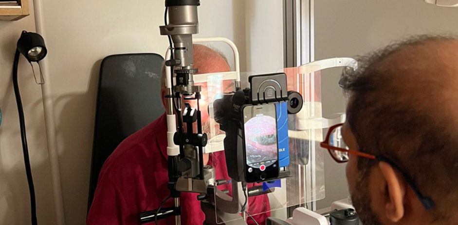 Mohamed Kasmani carrying out a dry eye assessment on a patient at Feltham Eyecare Centre